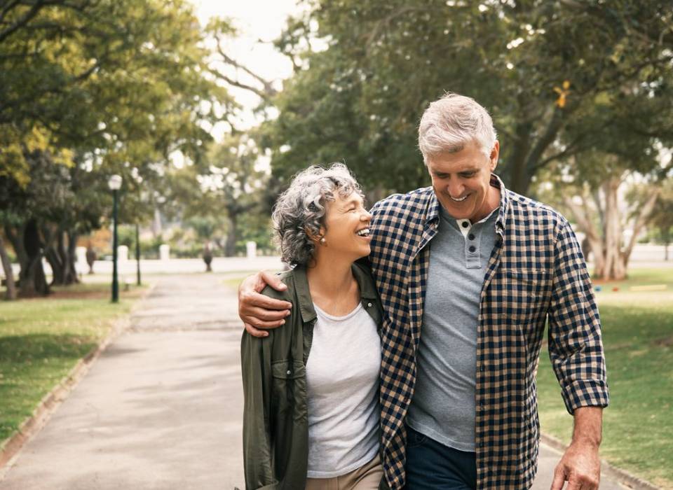 Elderly couple walking outside